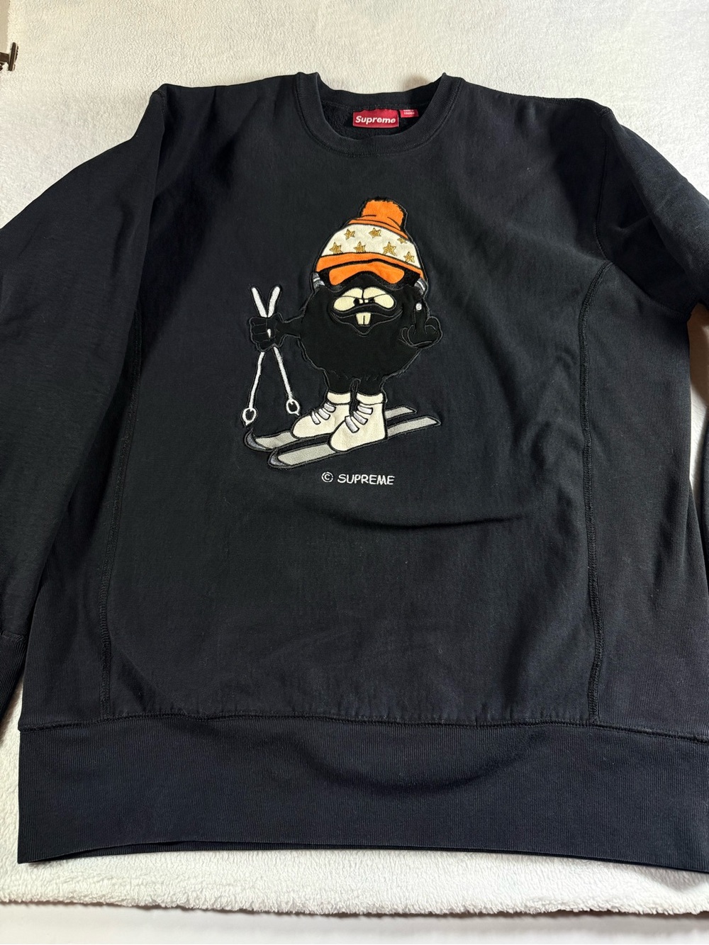 Supreme Black Crewneck with Orange Beanie Ski Graphic